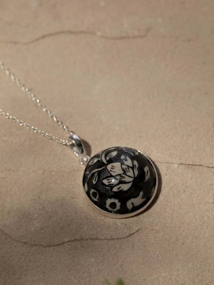 Detailed front view of ceramic pendant and chain showcasing its vibrant colors and unique design