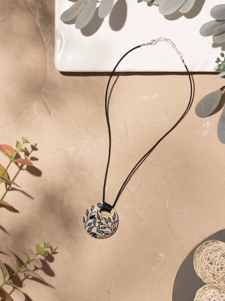 Styled detail view of Ceramic Pendant & Chain worn around the neck, shown in an alternate styled shot