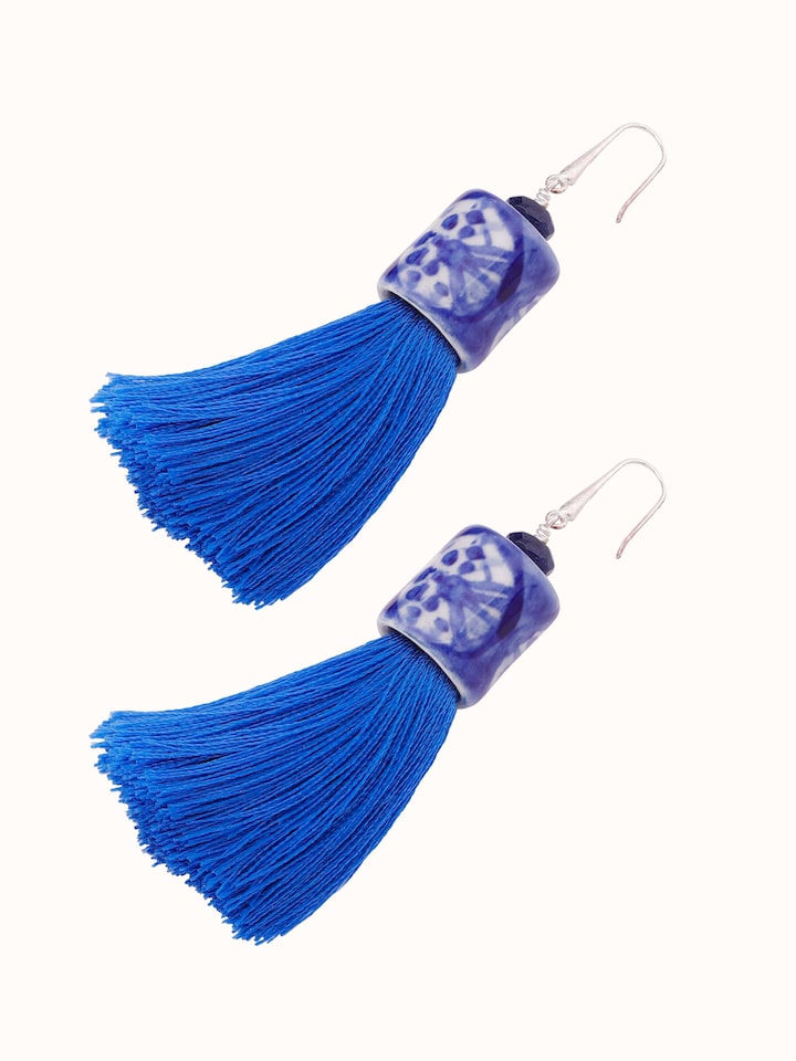 Overhead view of Ceramic Drop Earrings displaying the full design and artistic ceramic patterns