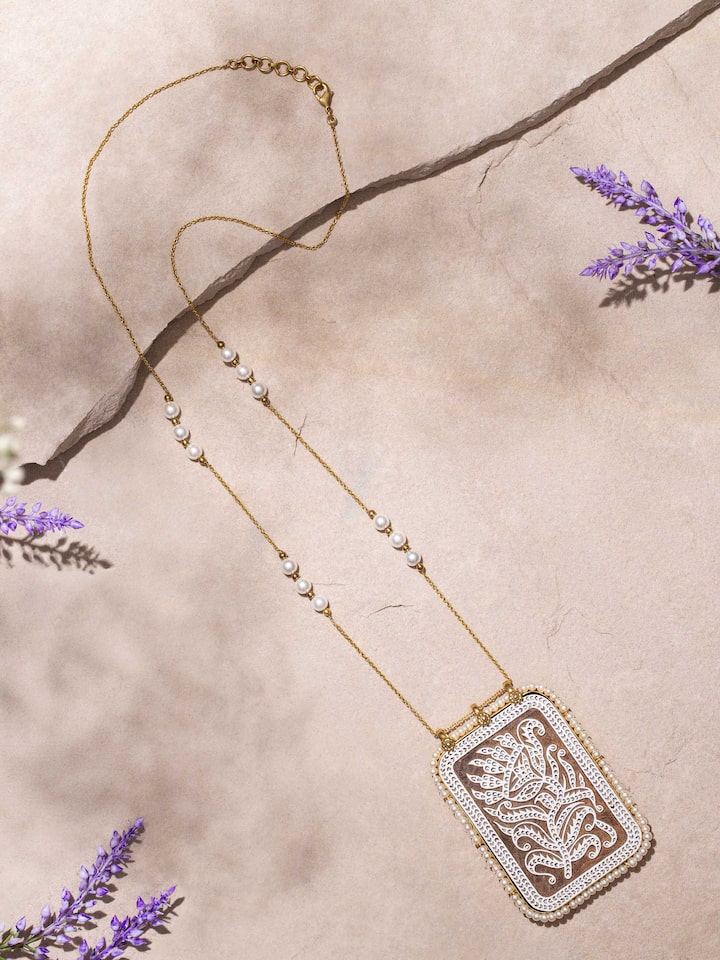 Close-up view of Wood Block Carving Long Necklace emphasizing the craftsmanship and detailed wood block carvings.