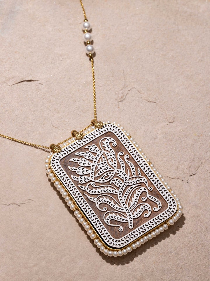Angled view of Wood Block Carving Long Necklace showcasing its intricate carvings and elegant design.