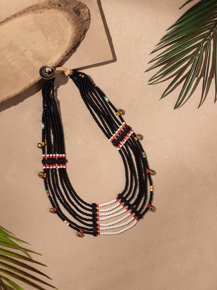 Side view of Beads & Faux Bones Collar Necklace highlighting its layered design and vibrant colors.