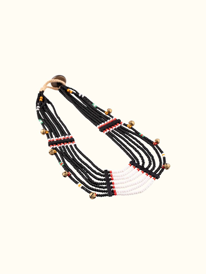 Angled view of Beads & Faux Bones Collar Necklace emphasizing its unique design and textures.