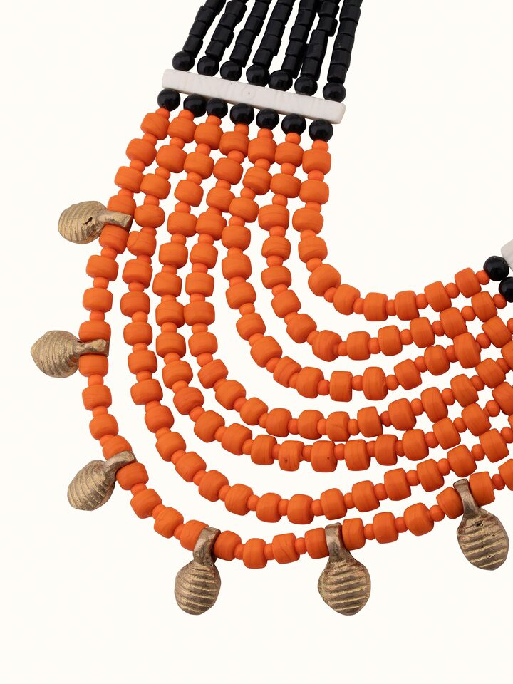 Angled view of Beads & Faux Bones Long Necklace showcasing its intricate arrangement and style.
