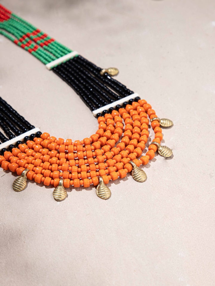 Back view of Beads & Faux Bones Long Necklace displaying its clasp and overall design.