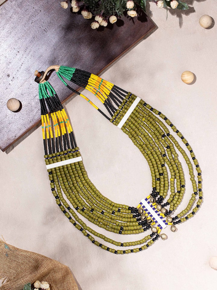 Side view of Beads & Faux Bones Long Necklace showcasing the intricate design and colorful accents.
