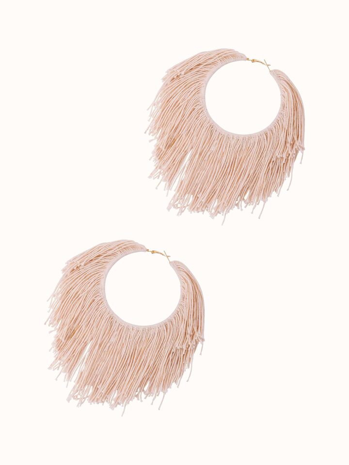 Angled view of Cotton Chord Hoops displaying the elegant curvature.