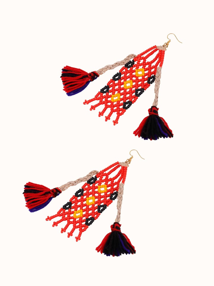 Artistic angle of Bead & Banana Fibre Drop Earrings displaying their unique texture and design elements.