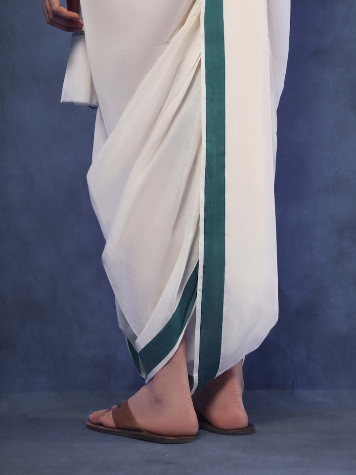 Angled view of green cotton angavastram set showing fine cotton weave and twin piece layout