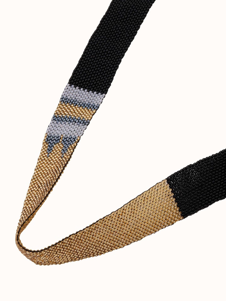 Angled view of Glass Beads Long Necklace showcasing its elegant design and rich bead colors.