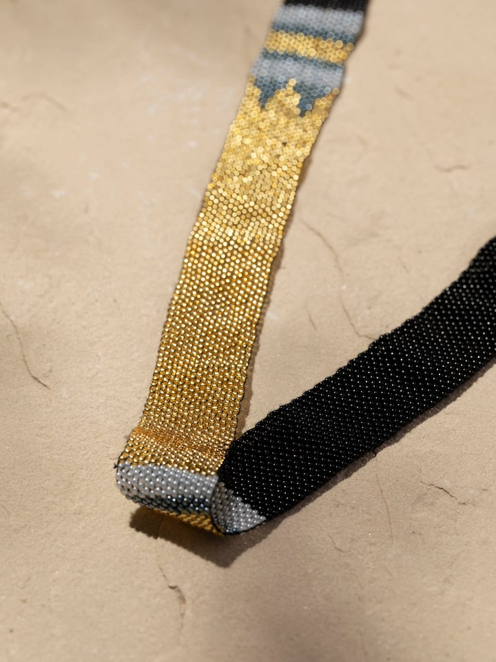 Detailed view of Glass Beads Long Necklace highlighting its intricate design and colorful beads.