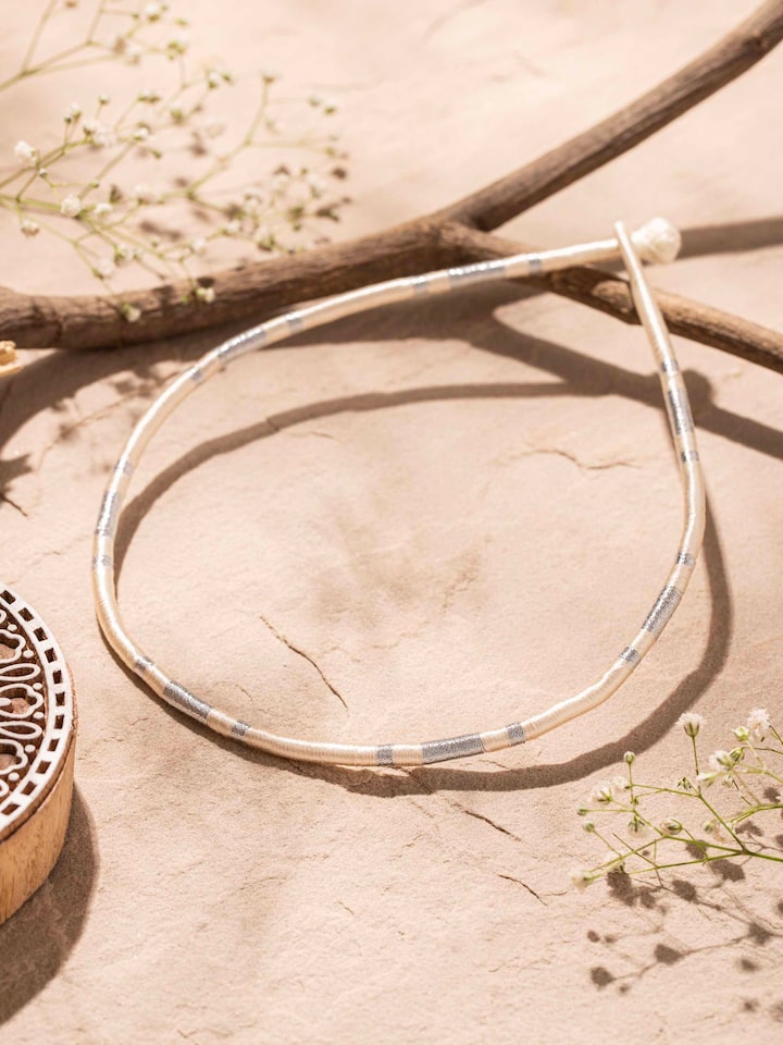Side view of Patwa collar necklace highlighting the detailed beadwork and traditional patterns