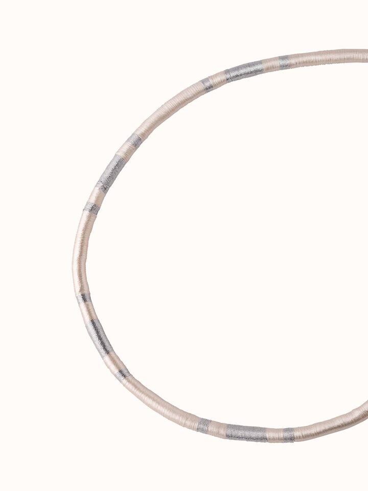 Angled view of Patwa collar necklace showcasing its unique shape and intricate design details