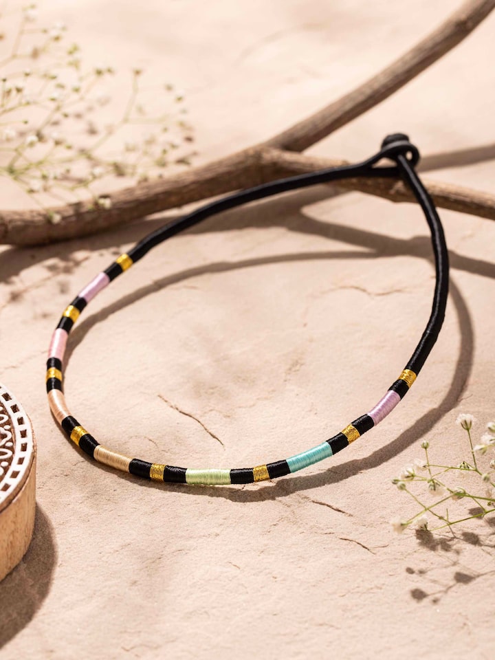 Close-up of Patwa Collar Necklace highlighting the intricate patwa design and collar details.