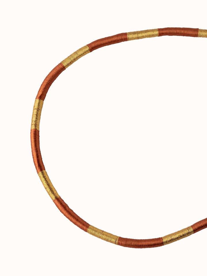 Angled view of Patwa Collar Necklace highlighting the intricate embroidery and design elements.