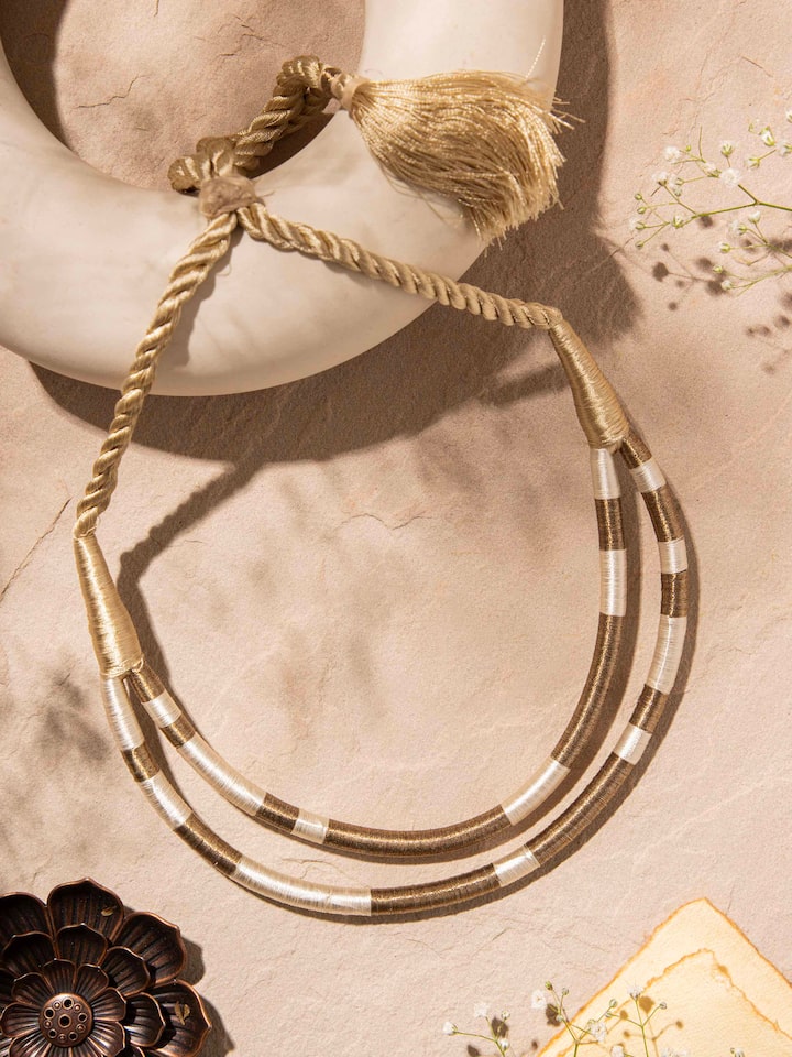 Close-up view of Patwa collar necklace highlighting detailed beadwork and design