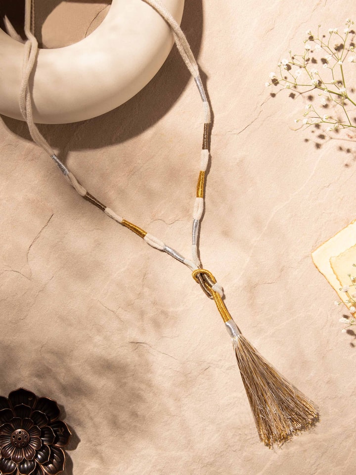 Side view of Patwa long necklace highlighting its detailed embroidery and traditional patterns