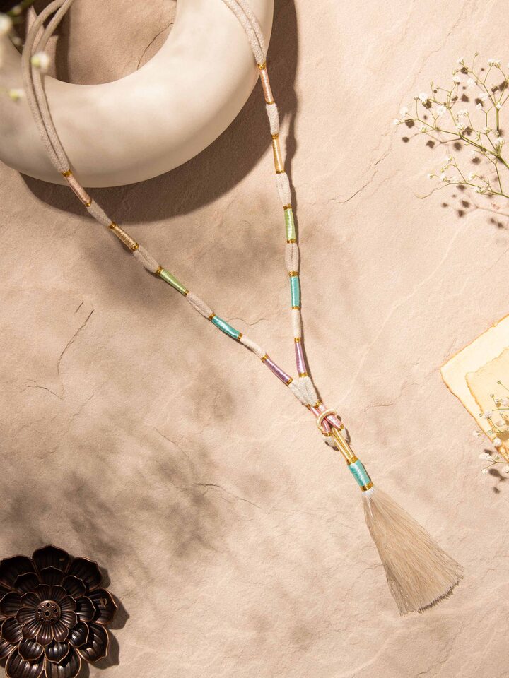 Side view of Patwa long necklace highlighting its detailed embroidery and traditional patterns