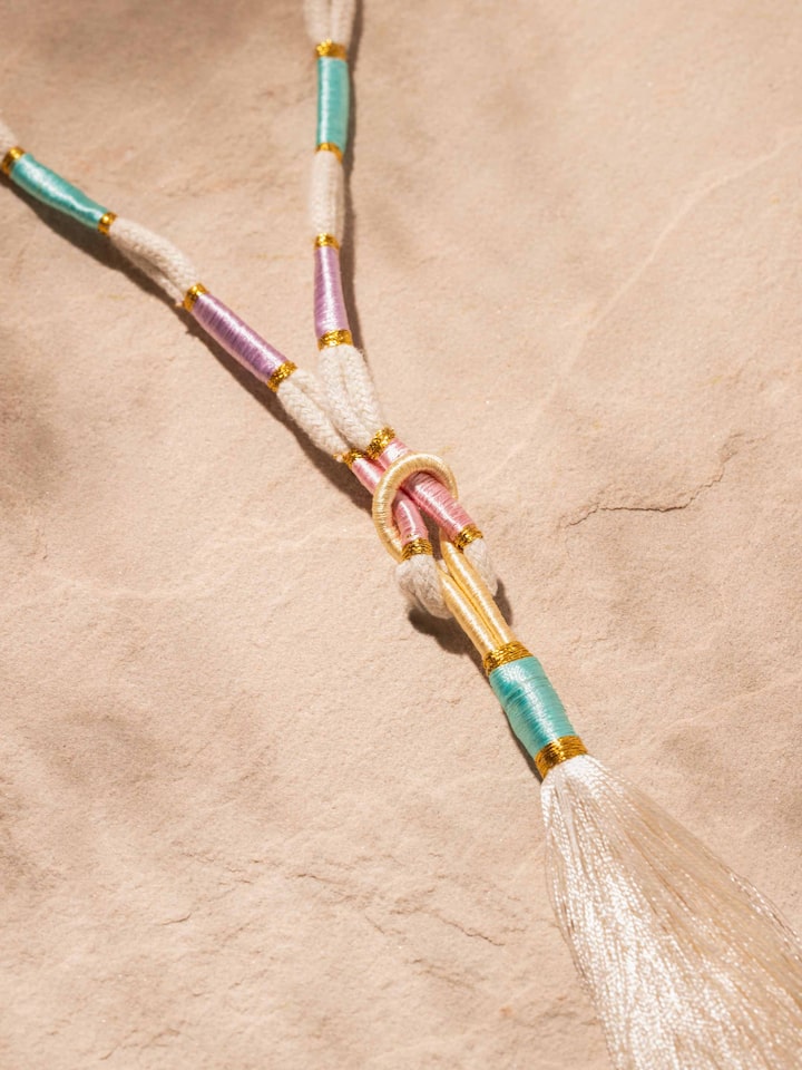 Detailed front view of Patwa long necklace highlighting its intricate beadwork and vibrant colors