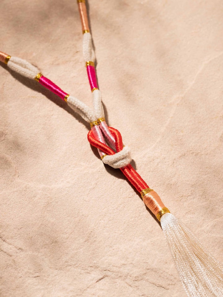 Detailed front view of Patwa long necklace showcasing its intricate patterns and vibrant colors