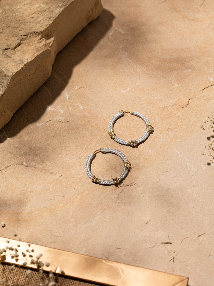 Side view of Zari Patwa hoop earrings highlighting their detailed embroidery and craftsmanship