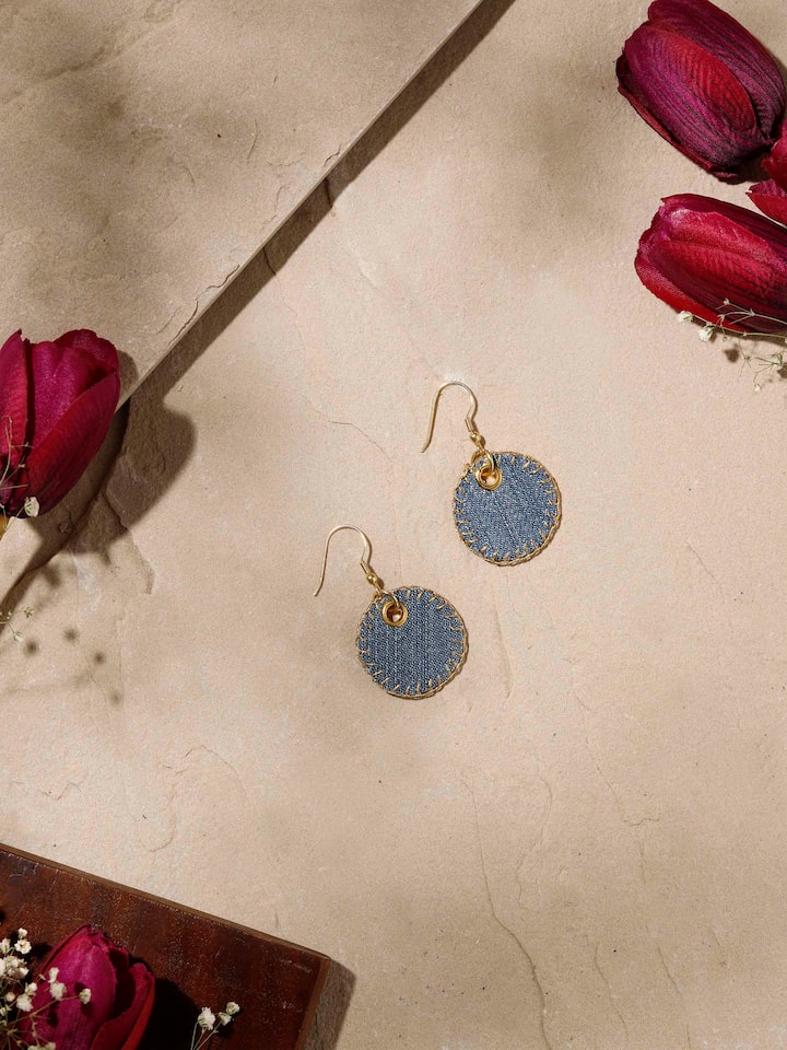 Styled detail view of Upcycled Drop Earrings worn on the ear, shown in an alternate styled shot