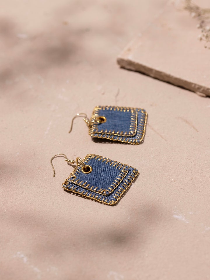 Detail view of Upcycled Drop Earrings highlighting the stone setting and metalwork detail