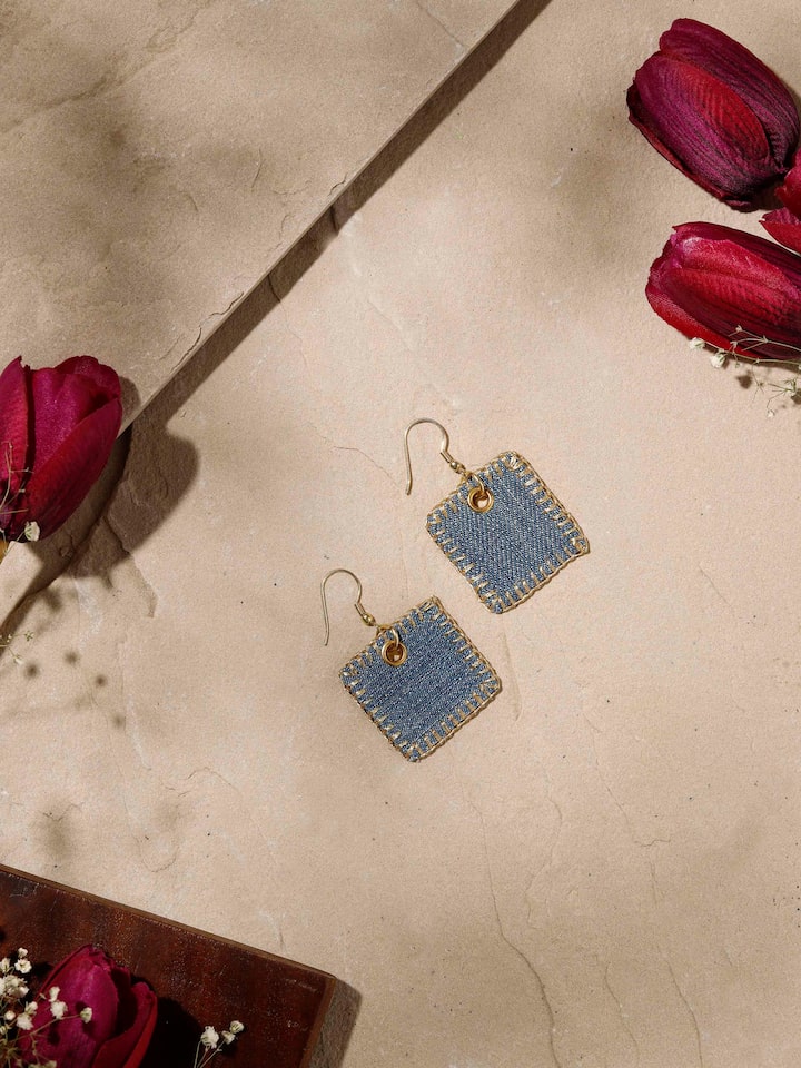Styled detail view of Upcycled Drop Earrings worn on the ear, shown in an alternate styled shot