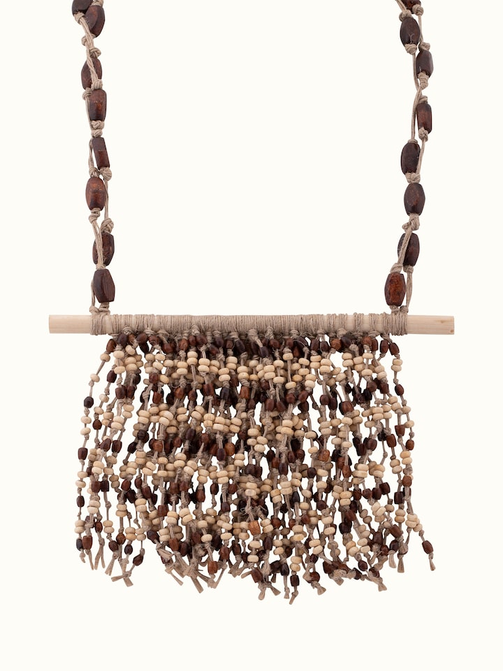 Angled view of Jute Long Necklace emphasizing its design and natural material.