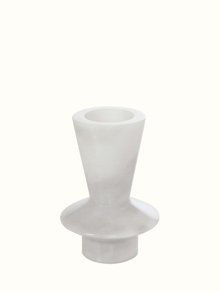 Detailed view of black carved marble candle holders, emphasizing their intricate design and quality.