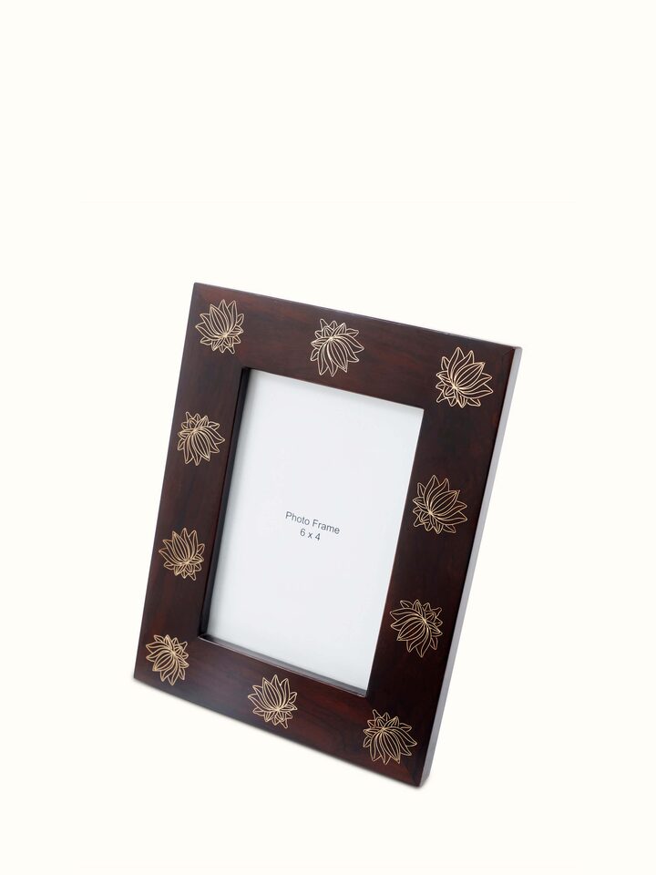 Angled view of Tarkashi sheesham wood & brass lotus photo frame displaying the fine details of the wood and brass work