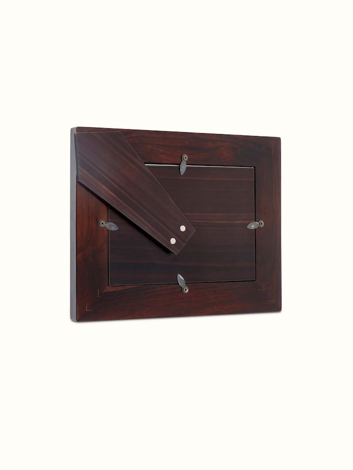 Detailed view of Tarkashi sheesham wood & brass lotus photo frame focusing on the decorative brass elements and smooth wood finish