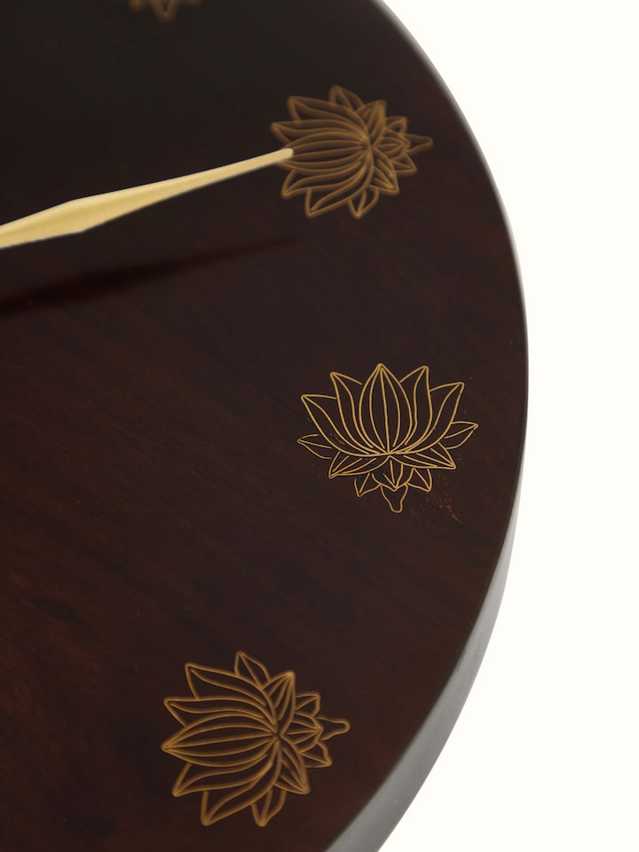 Close-up view of natural tarkashi sheesham wood & brass wall clock, highlighting the fine details.
