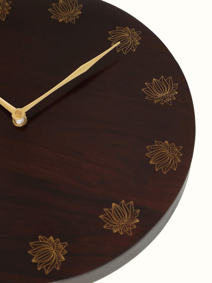 Artistic view of natural tarkashi sheesham wood & brass wall clock, showcasing the intricate design.