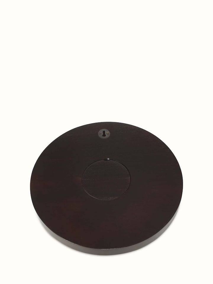Close-up view of natural tarkashi sheesham wood & brass wall clock, emphasizing the detailed work.