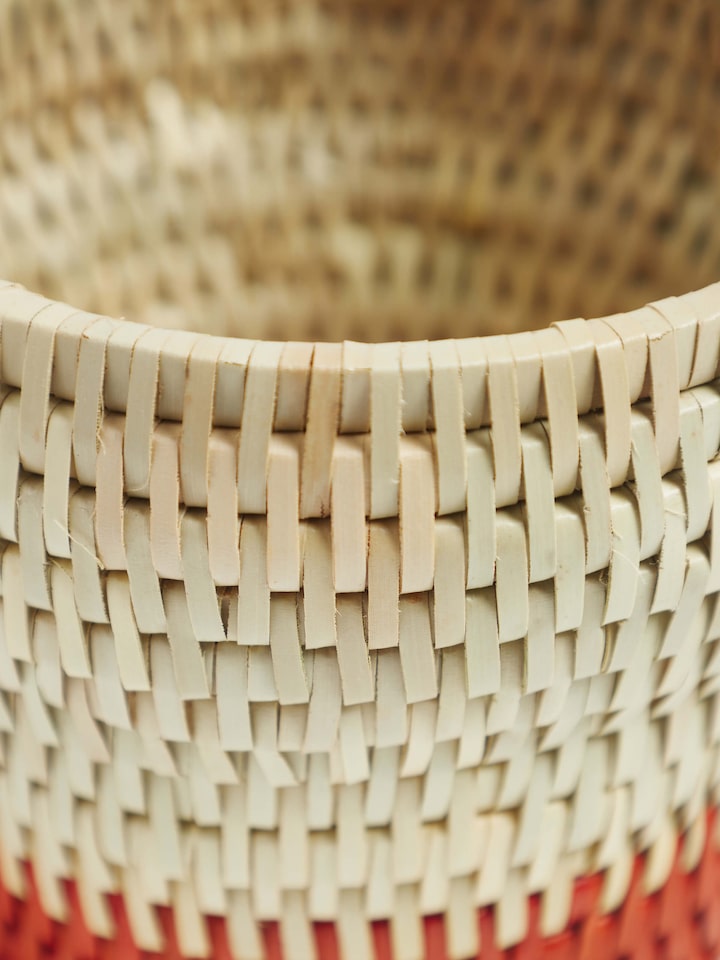 Angled view of Palm Leaf Cutlery Holder displaying its practical design and natural coloring