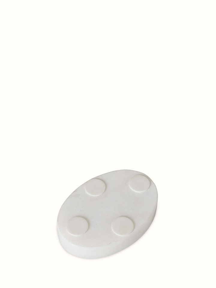 Top view of a white Pacchikari marble tea light holder, emphasizing its circular design and polished finish.