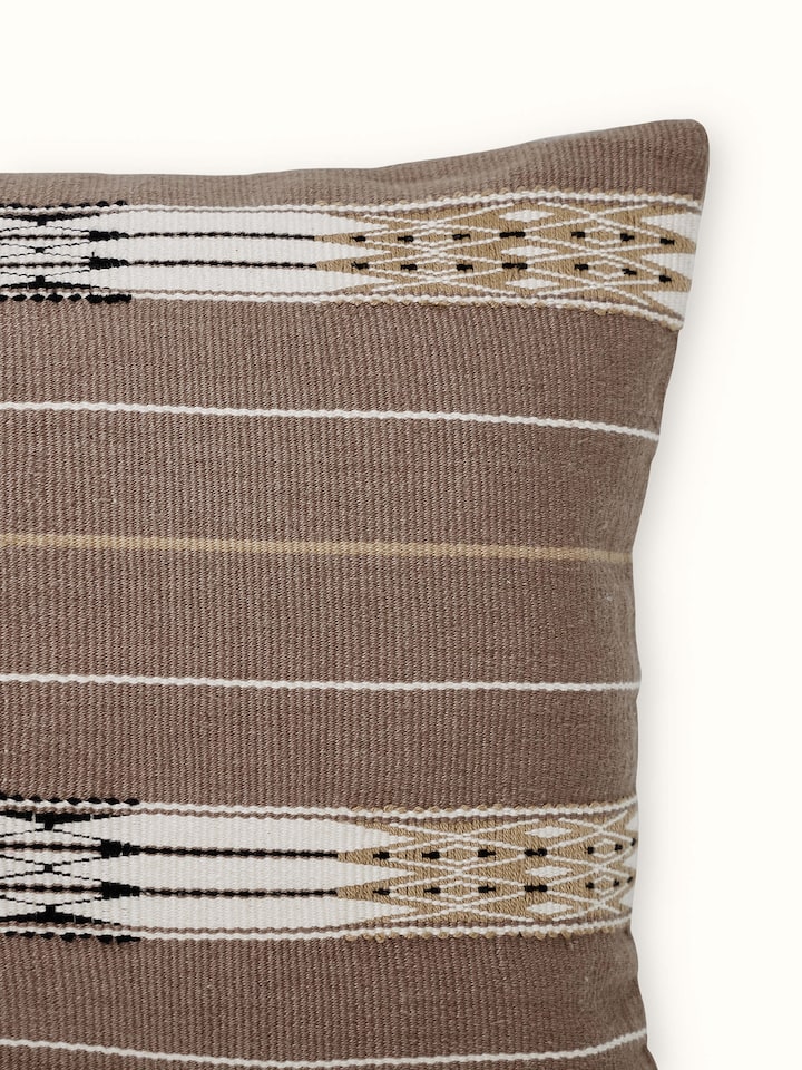 Detailed view of Ridhama khakhi jani cotton Naga handloom cushion cover showing the intricate handloom pattern and khakhi color.