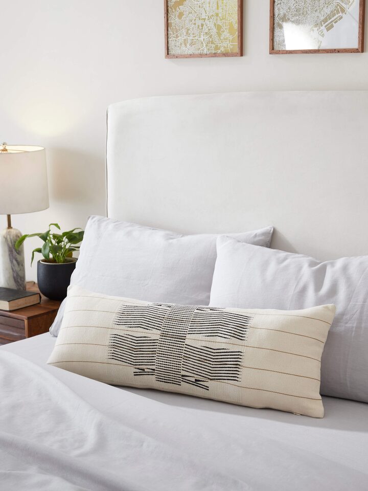 Close-up of Ridhama white Kalinda cotton Naga handloom cushion cover highlighting the intricate handloom details.