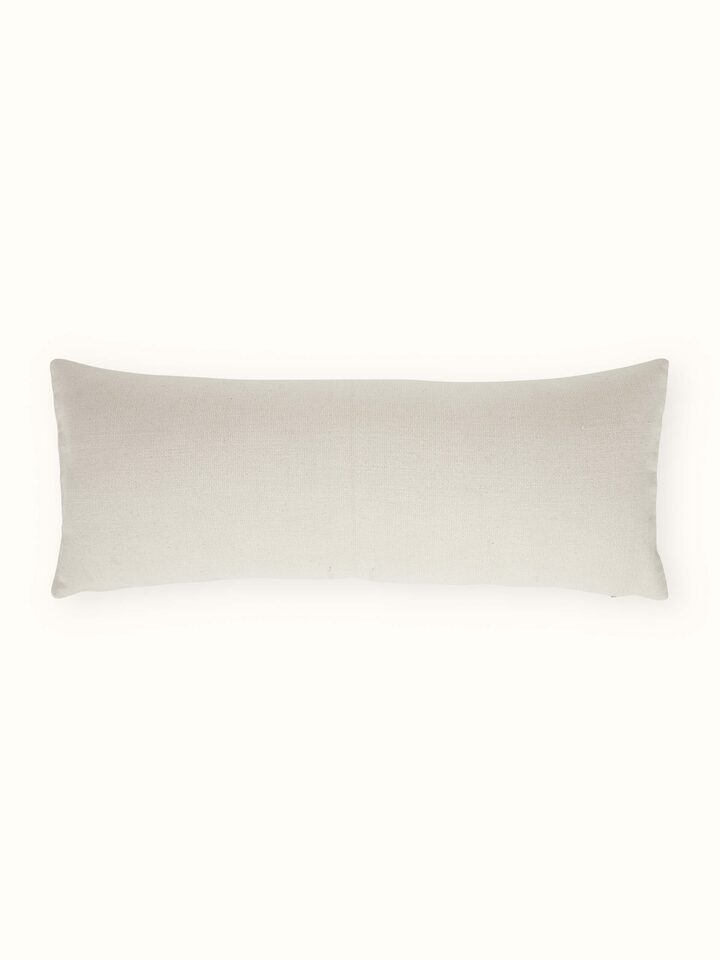 Side view of Ridhama white Kalinda cotton Naga handloom cushion cover showing its texture and fabric quality.