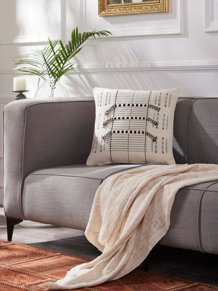 Close-up of Ridhama White Lanka Cotton Naga Handloom Cushion Cover, highlighting the detailed handloom craftsmanship.