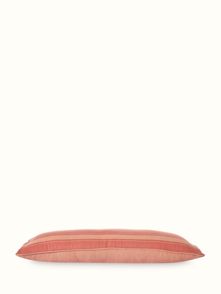 Close-up view of Godna peach stripe cotton handwoven pattu cushion cover focusing on the handwoven texture and design details.