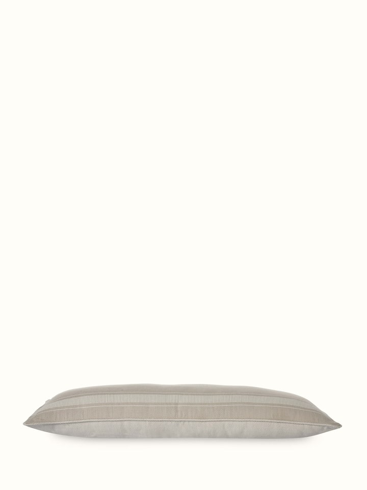 Angle view of Godna Light Beige Stripe Cotton Handwoven Pattu Lumbar Cushion Cover highlighting the striped pattern.