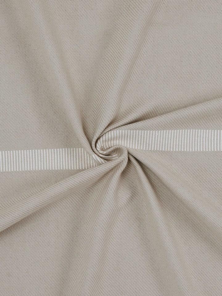Angled view highlighting the soft cotton weave and traditional handloom pattern.