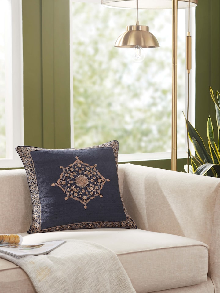 Styled view of Alankar Dark Blue Buta Silk Zardozi Embroidered Cushion Cover styled on a table or bed setting