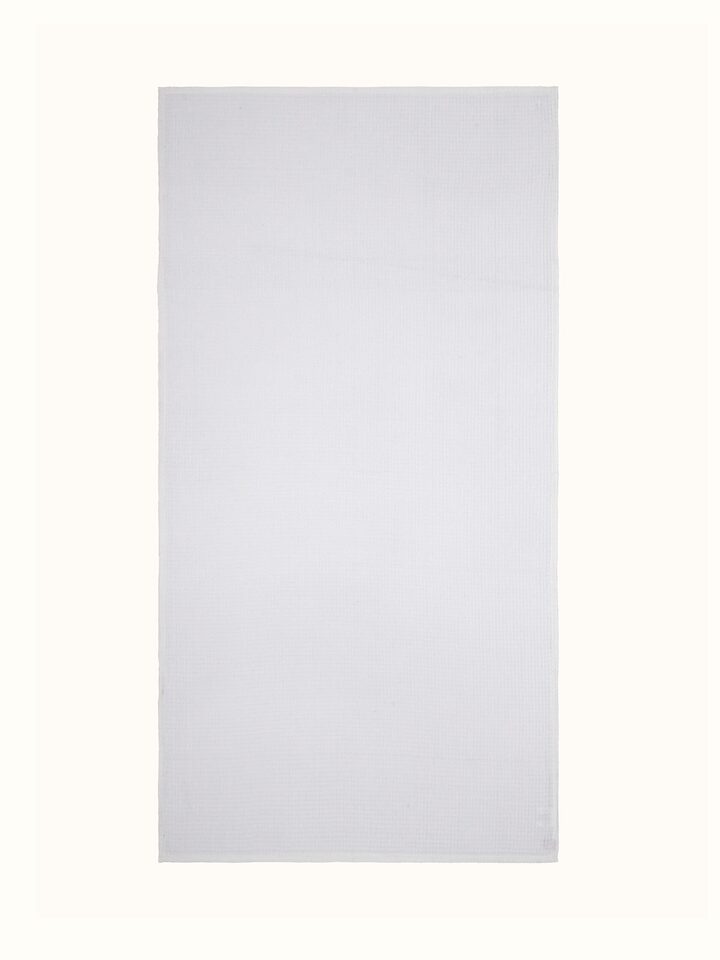 Full view of Amala waffle white solid cotton bath towel showcasing its texture and size
