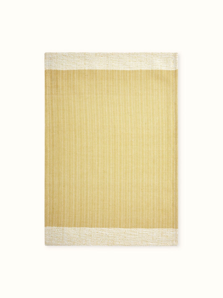 Detailed view of Vayana solid yellow stripe cotton hand towels, showcasing the towel's material and stripes