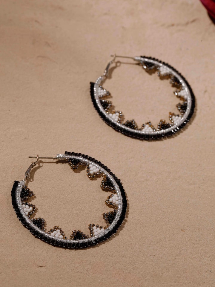 Artistic view of handcrafted hoop earrings featuring unique pattern and craftsmanship