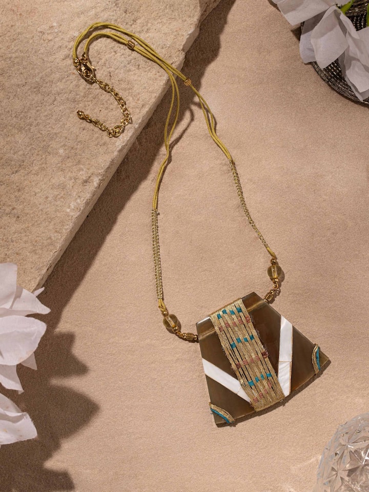 Close-up of handcrafted long necklace highlighting the intricate detailing and high-quality materials.