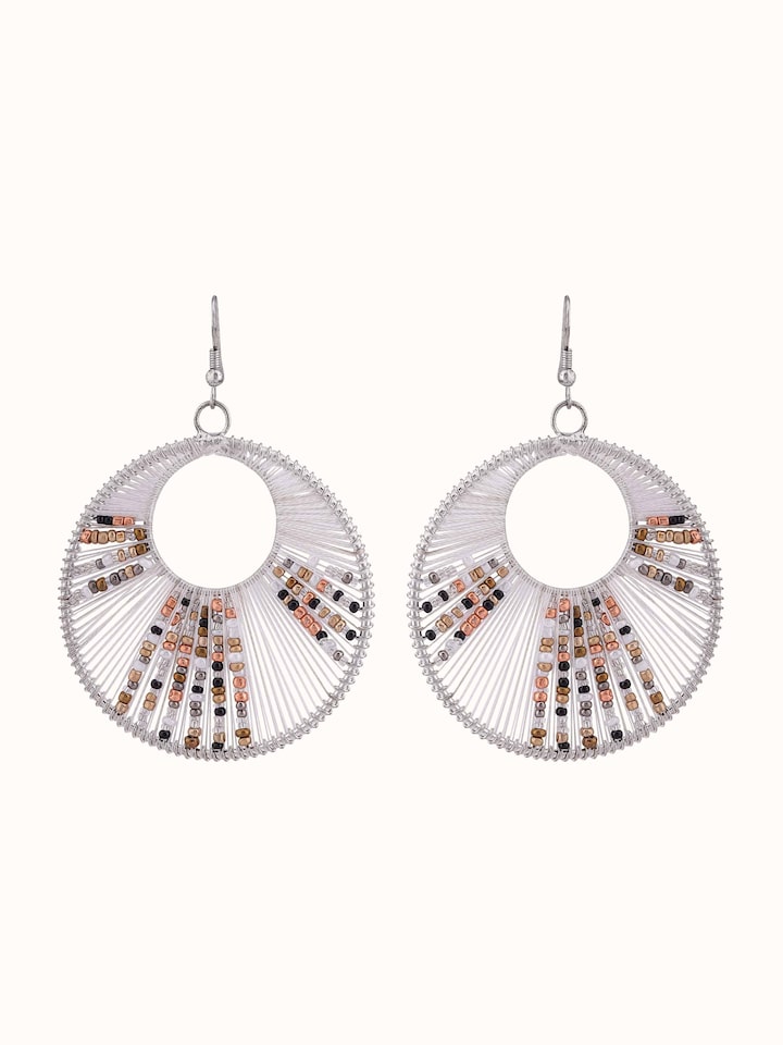 Front view of handcrafted drop earrings showcasing detailed design and craftsmanship.